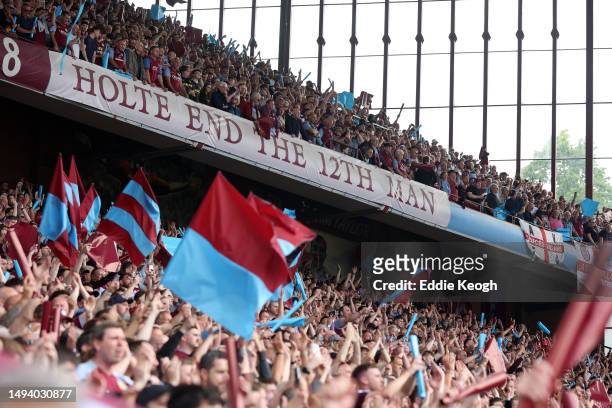 Aston Villa fans show their support during the Premier League match between Aston Villa and Brighton & Hove Albion at Villa Park on May 28, 2023 in...