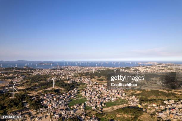 wind farms on the island - sea islands stock pictures, royalty-free photos & images