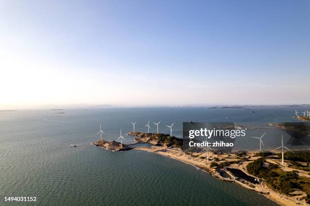 a bird's eye view of the island's wind farm - sea islands stock pictures, royalty-free photos & images