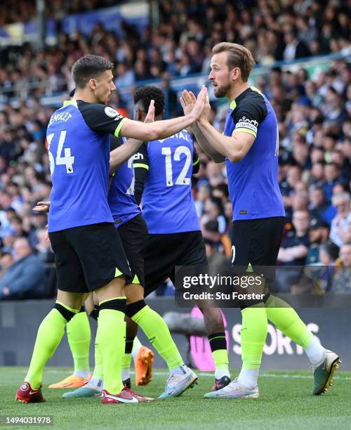 Harry Kane of Tottenham Hotspur celebrates with teammates after scoring the team's first goal during the Premier League match between Leeds United...