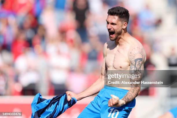 Tim Kleindienst of 1. FC Heidenheim 1846 celebrates after the team's victory and promotion to the Bundesliga in the Second Bundesliga match between...