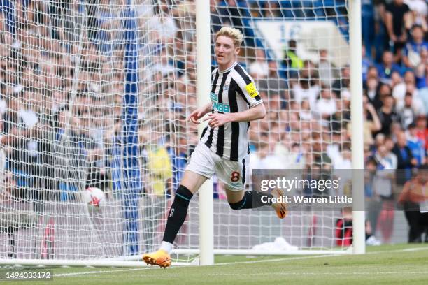 Anthony Gordon of Newcastle United celebrates after scoring the team's first goal during the Premier League match between Chelsea FC and Newcastle...