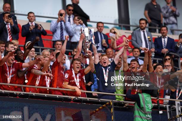 Carlisle United players lift the League Two Play-Off trophy after their victory and promotion to League One during the Sky Bet League Two Play-Off...