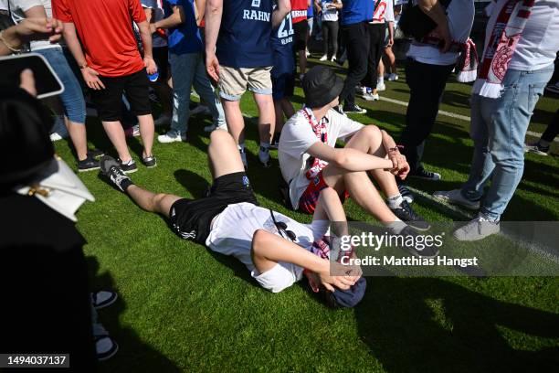 Fans of Hamburger SV look dejected after their team misses out on an automatic promotion to the Bundesliga after the team's victory in the Second...