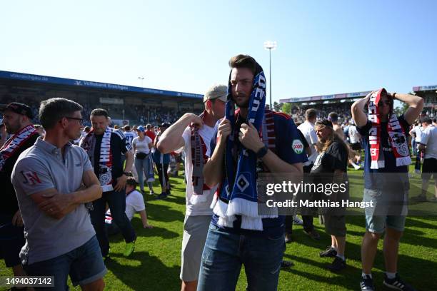 Fans of Hamburger SV look dejected after their team misses out on an automatic promotion to the Bundesliga after the team's victory in the Second...