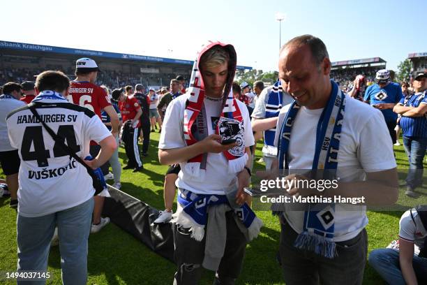 Fans of Hamburger SV look dejected after their team misses out on an automatic promotion to the Bundesliga after the team's victory in the Second...