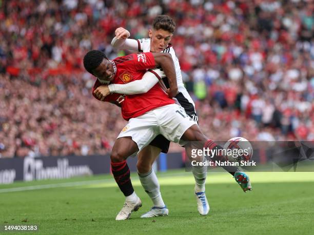 Tyrell Malacia of Manchester United battles for possession with Harry Wilson of Fulham during the Premier League match between Manchester United and...