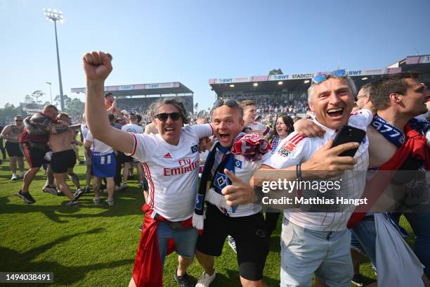 Hamburger SV fans celebrate after the team's victory, before 1. FC Heidenheim 1846 scored a last minute goal, to confirm Hamburger SV's 3rd place...