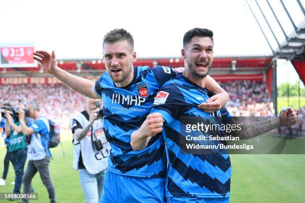 Patrick Mainka and Tim Kleindienst of 1. FC Heidenheim 1846 celebrate after the team's victory and promotion as champions during the Second...
