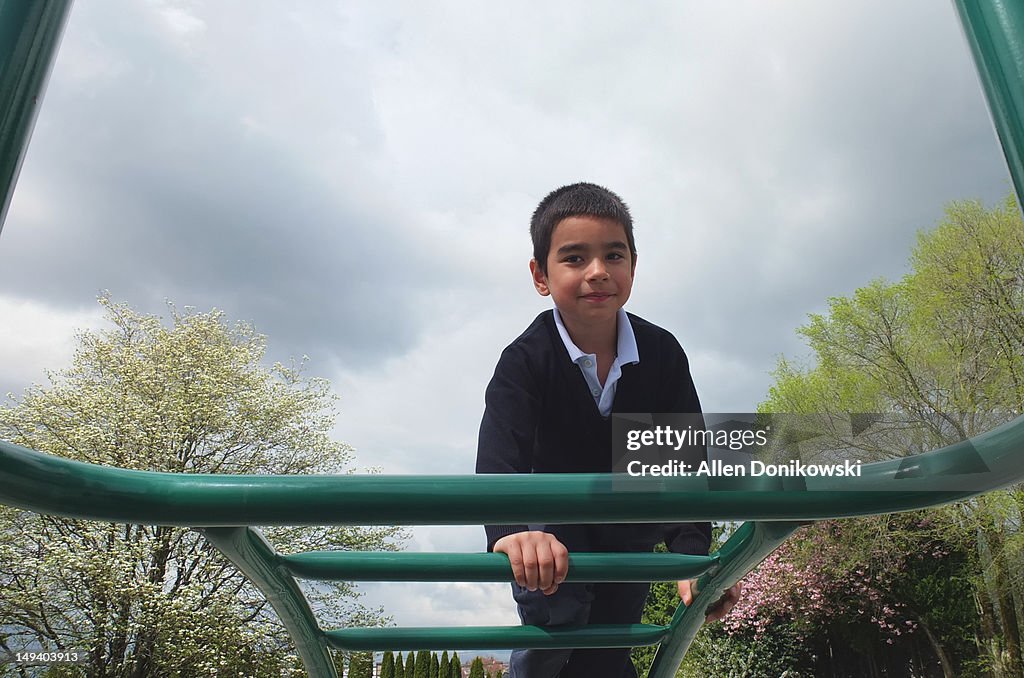 School boy climbing