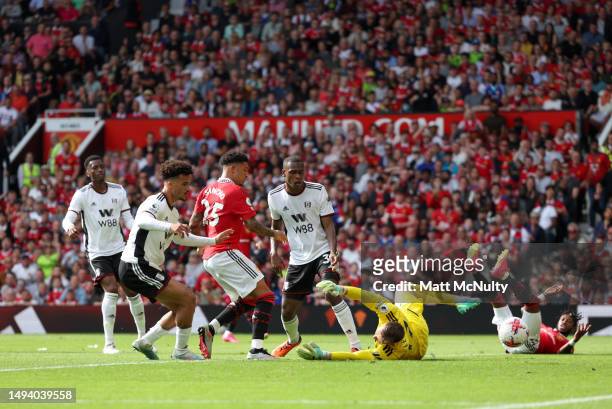 Jadon Sancho of Manchester United scores the team's first goal during the Premier League match between Manchester United and Fulham FC at Old...