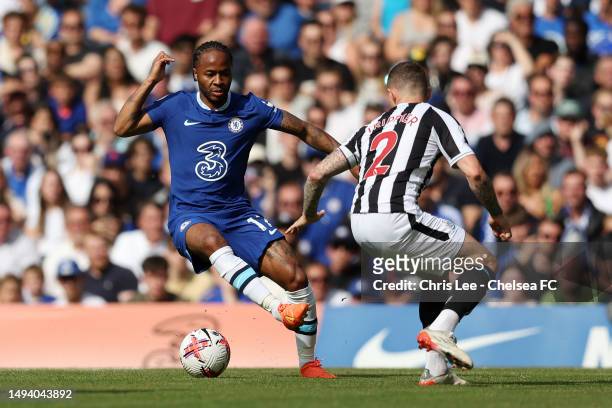 Raheem Sterling of Chelsea is challenged by Kieran Trippier of Newcastle United during the Premier League match between Chelsea FC and Newcastle...