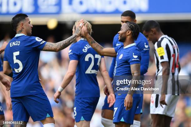 Raheem Sterling of Chelsea celebrates with teammate Enzo Fernandez after Kieran Trippier of Newcastle United scores an own goal during the Premier...