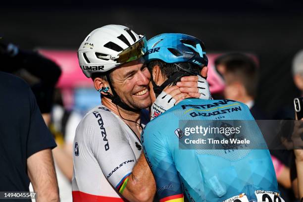 Mark Cavendish of The United Kingdom and Astana Qazaqstan Team celebrates at finish line as stage winner with his teammate Luis León Sánchez of Spain...