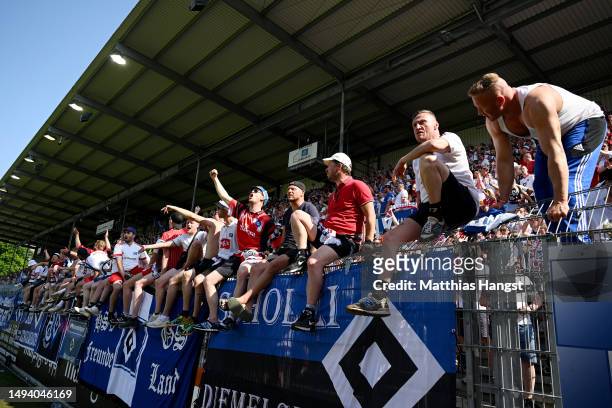 Hamburger SV fans celebrate after the team's victory, before 1. FC Heidenheim 1846 scored a last minute goal, to confirm Hamburger SV's 3rd place...