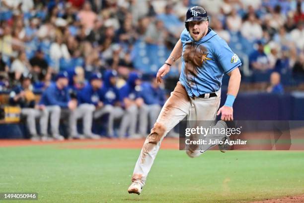 Luke Raley of the Tampa Bay Rays looks to score on an RBI off the bat of Yandy Diaz in the third inning against the Los Angeles Dodgers at Tropicana...