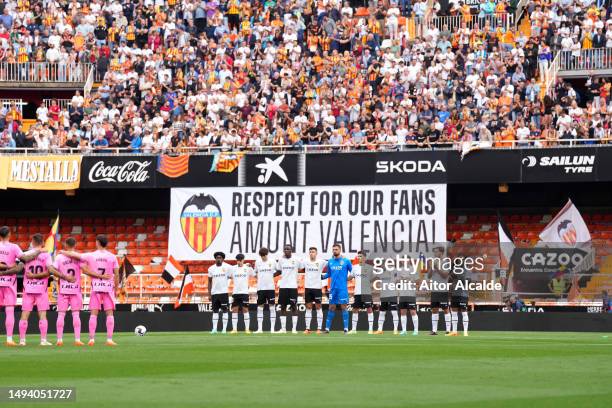 Empty seats are seen inside the stadium where a banner reads "Juntos Contra El Racismo Together against Racism" as both teams line up prior to the...