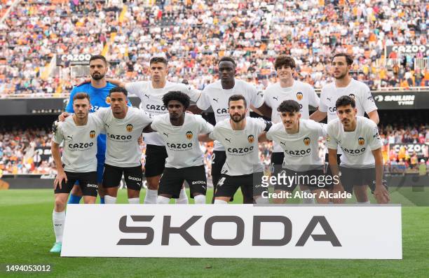 Valencia CF players pose for a photo on pitch ahead of the LaLiga Santander match between Valencia CF and RCD Espanyol at Estadio Mestalla on May 28,...