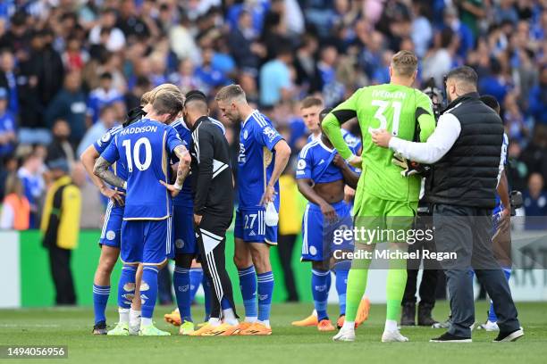 Leicester City players watch the Everton v AFC Bournemouth game after the team's victory during the Premier League match between Leicester City and...