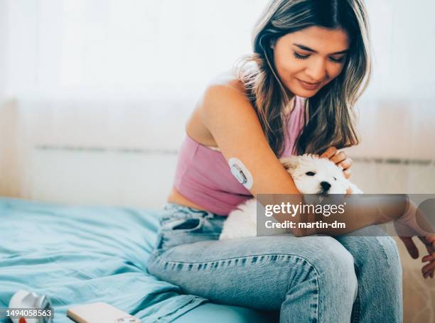 day in the life of young woman with type 1 diabetes - continuous glucose monitor stock pictures, royalty-free photos & images