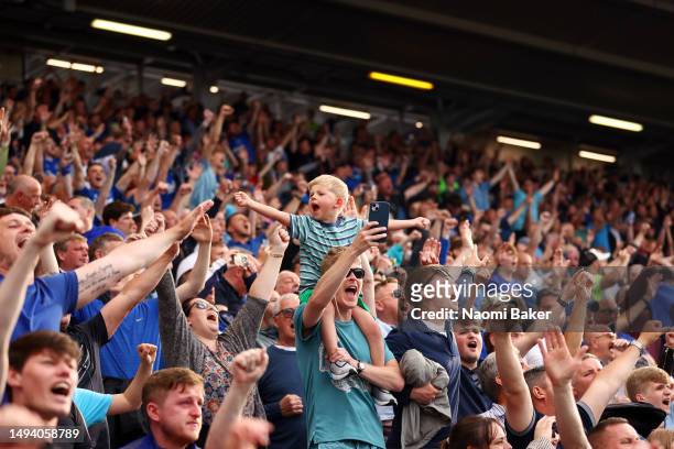 Fans of Everton celebrate after their sides victory, which secures their position in the Premier League next season, in the Premier League match...