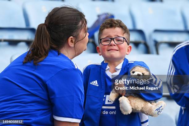 Leicester City fan looks dejected after their sides defeat, resulting in their relegation to the Championship during the Premier League match between...