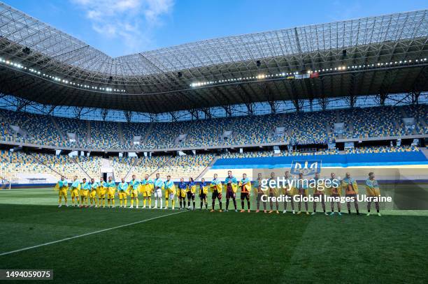 Shakhtar Donetsk and Dnipro-1 Dnipro teams perform the national anthem of Ukraine before the start of the match on May 28, 2023 in Lviv, Ukraine. On...