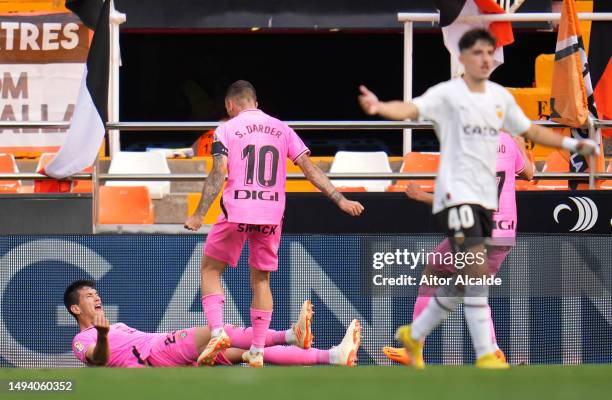 Cesar Montes of RCD Espanyol celebrates with teammate Sergi Darder after scoring the team's first goal during the LaLiga Santander match between...