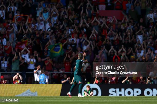 Roberto Firmino of Liverpool applauds the away fans as he is subbed off during the Premier League match between Southampton FC and Liverpool FC at...