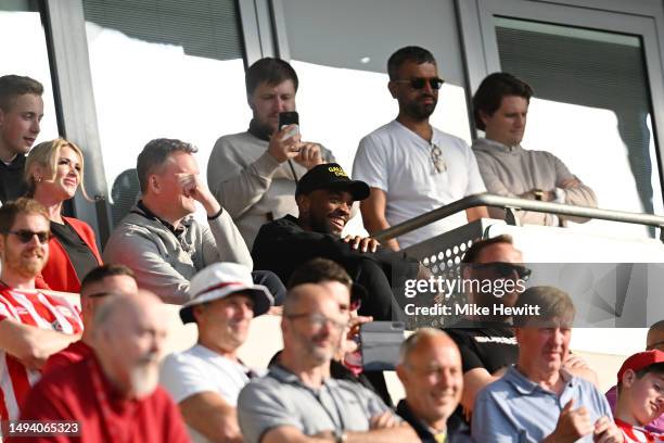 Ivan Toney of Brentford looks on from the stand after the Premier League match between Brentford FC and Manchester City at Gtech Community Stadium on...