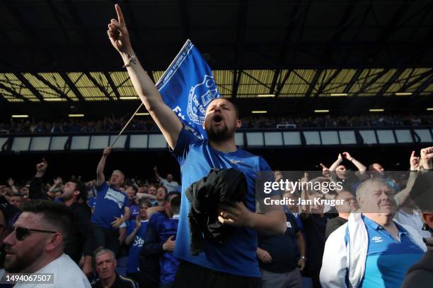 Fans of Everton celebrate after their sides victory, which secures their position in the Premier League next season, in the Premier League match...