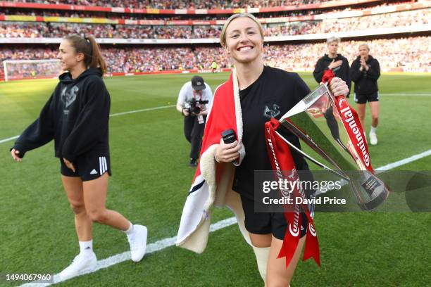 Leah Williamson of Arsenal poses for a photo with the FA Women's Continental Tyres League Cup after the Premier League match between Arsenal FC and...