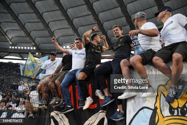 Stefan Radu of SS Lazio and Senad Lulic greets his fans at the end of the Serie A match between SS Lazio and US Cremonese at Stadio Olimpico on May...