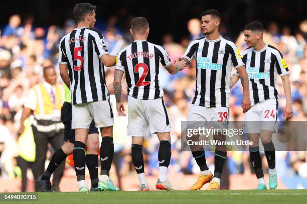 Bruno Guimaraes of Newcastle United embraces teammates after the draw during the Premier League match between Chelsea FC and Newcastle United at...