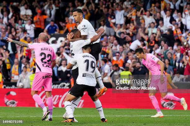 Lino of Valencia CF celebrates with teammate Justin Kluivert after scoring the team's second goal during the LaLiga Santander match between Valencia...