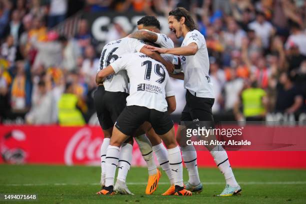 Lino of Valencia CF celebrates with teammates after scoring the team's second goal during the LaLiga Santander match between Valencia CF and RCD...