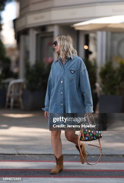 Karin Teigl wearing Bash paris velvet beige leather boots, Prada denim sweatshirt skirt, Andy Wolf brown shades, Julia Skergeth big Pearl chain and...