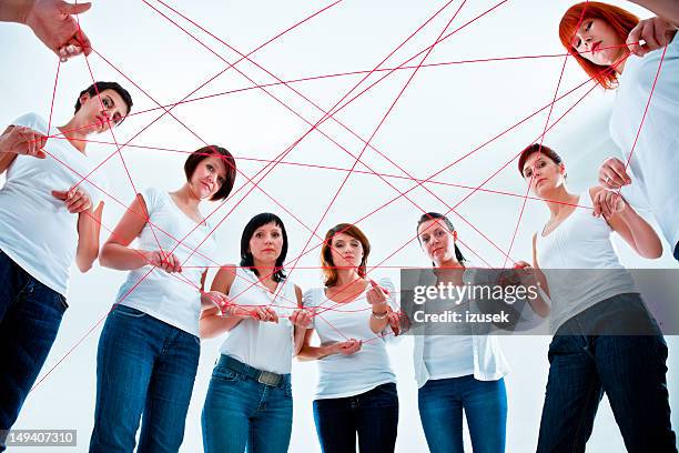 tangled in the network - red string stock pictures, royalty-free photos & images