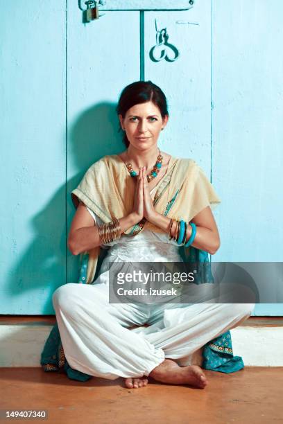 woman in namaste pose - goa resort stock pictures, royalty-free photos & images