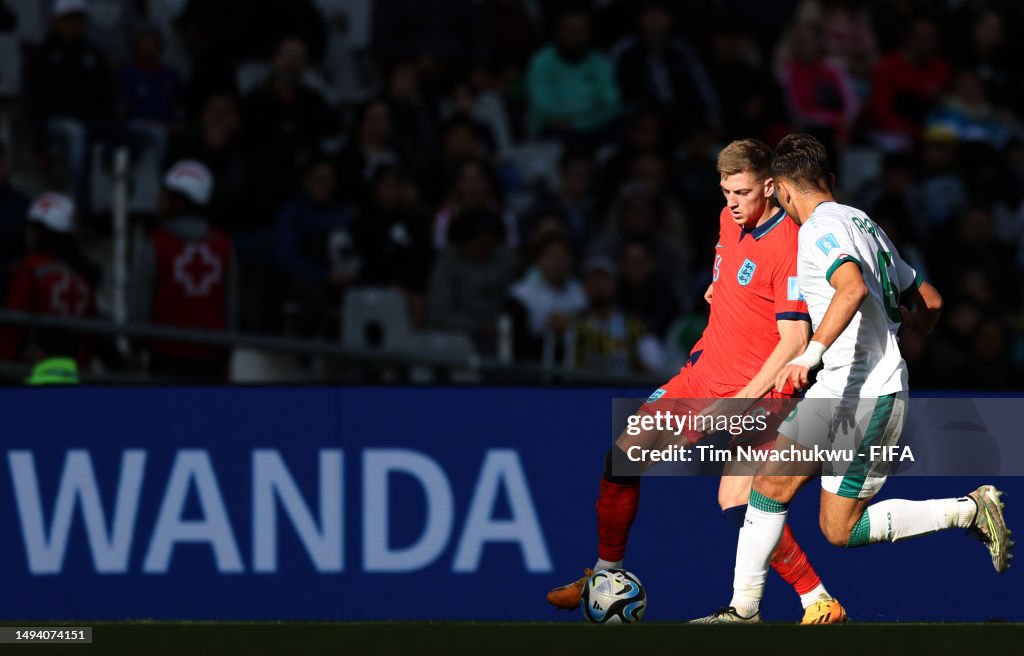 Ada Rasheed N Xavier Simons of England battles for the ball with Adam Rasheed of ...