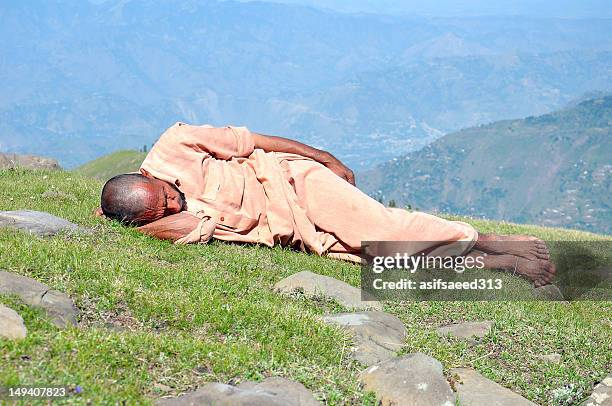 Man Sleeping On Rock Photos and Premium High Res Pictures - Getty Images