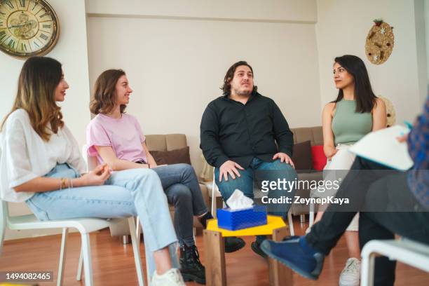 overweight man talking to professional therapist, group therapy - overweight 40 year old male concerned stock pictures, royalty-free photos & images