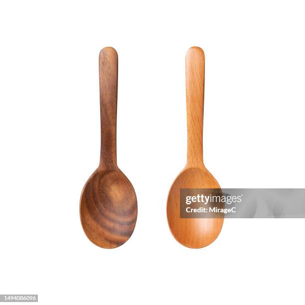 wooden spoons isolated on white - cuchara-de-madera fotografías e imágenes de stock