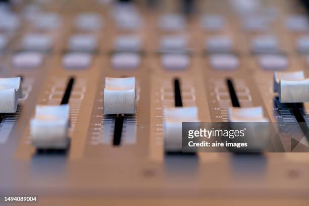 close up of a mixing console with buttons for sound control at parties - electronic music production stock pictures, royalty-free photos & images