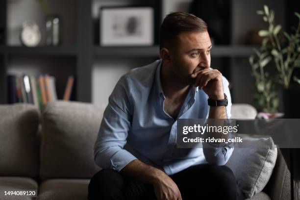 pensive lost in thoughts suffering from depression - pessimisme stock pictures, royalty-free photos & images