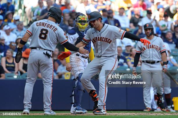 Blake Sabol of the San Francisco Giants celebrates a three run home run with Michael Conforto during the seventh inning against the Milwaukee Brewers...