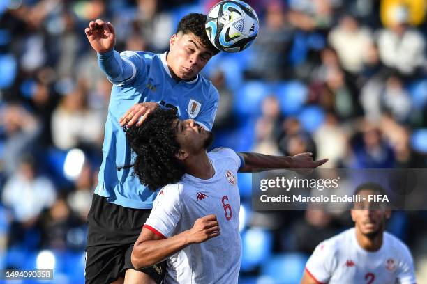 Alan Matturro of Uruguay competes for the ball against Ghaith Ouahabi of Tunisia during the FIFA U-20 World Cup Argentina 2023 Group E match between...