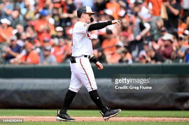Austin Hays of the Baltimore Orioles celebrates after driving in a run with a single in the eighth inning against the Texas Rangers at Oriole Park at...