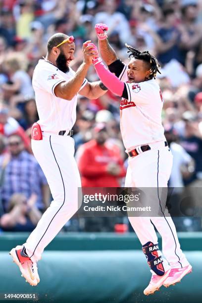 José Ramírez and Amed Rosario of the Cleveland Guardians celebrate a walk-off two-run double by Ramírez to defeat the St. Louis Cardinals 4-3 at...