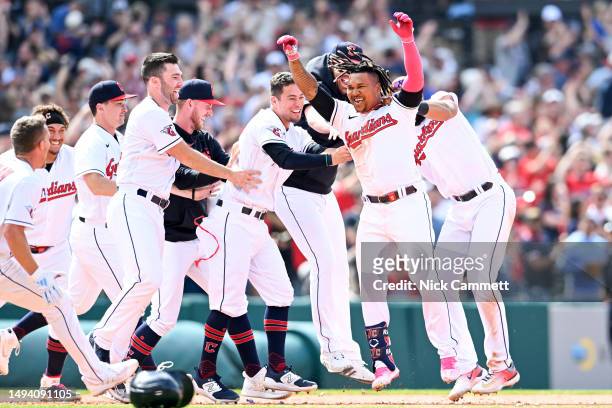 José Ramírez of the Cleveland Guardians celebrates with teammates after hitting a walk-off two-run double to defeat the St. Louis Cardinals 4-3 at...